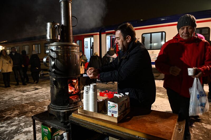 The station's thermometer shows minus 11C but there's a warm atmosphere around the train.