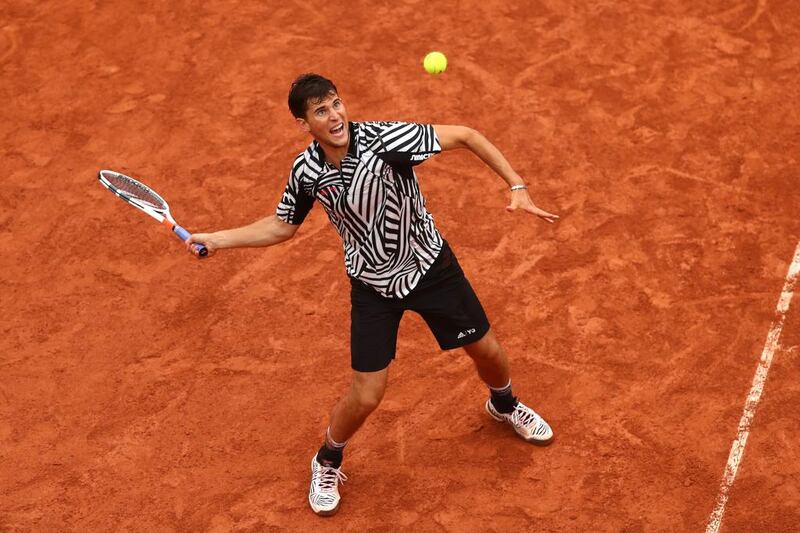 Dominic Thiem of Austria hits a forehand during his fourth-round match against Marcel Granollers of France. Julian Finney / Getty Images
