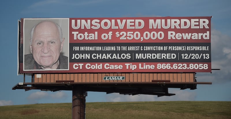 A billboard referencing the murder of Mr Carman's grandfather. Tribune News Service / Getty Images 
