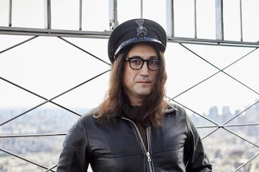 Sean Ono Lennon poses for a portrait on the observation deck of the Empire State building in New York to promote an album being released of his father's best known songs. AP