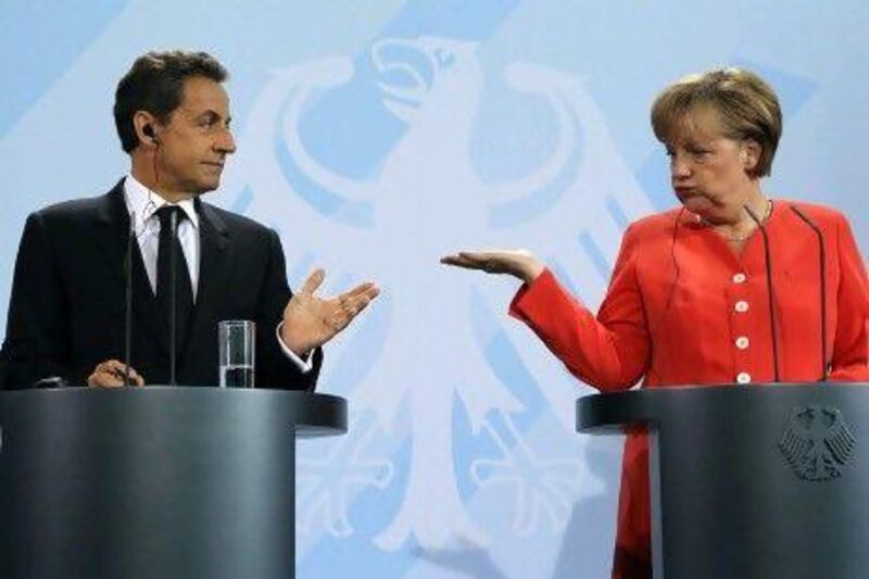 Nicolas Sarkozy, the president of France, with Angela Merkel, the German chancellor, in Berlin. France and Germany are the two two most powerful members of the euro zone. Fabrizio Bensch / Reuters