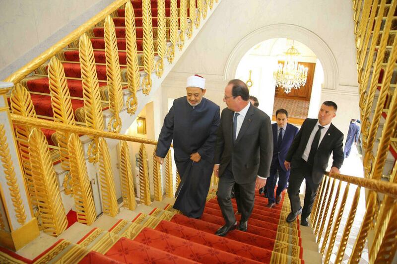 French president Francois Hollande with Egypt’s Grand Imam of Al Azhar Mosque, Ahmed El Tayyeb, in Paris. Dr El Tayyeb was recently received by Pope Francis. Courtesy The Muslim Council of Elders