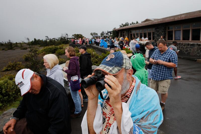 Visitors view Kilauea's summit crater outside the Jaggar Museum in Volcanoes National Park, Hawaii. Jae C. Hong / AP Photo