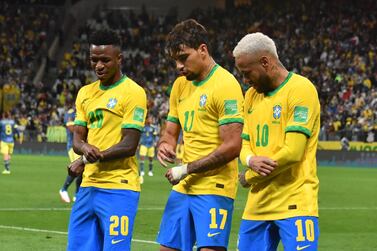 Brazil's Lucas Paqueta (C) celebrates with teammates Vinicius Junior (L) and Neymar after scoring against Colombia during the South American qualification football match for the FIFA World Cup Qatar 2022, at the Neo Quimica Arena, previously known as Arena Corinthians, in Sao Paulo, Brazil, on November 11, 2021.  (Photo by NELSON ALMEIDA  /  AFP)