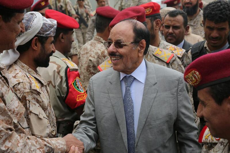 Yemen's vice president Ali Muhssien Al Ahmar (C) shakes hands with army officers as he visits a military barracks in the country's central province of Marib on August 15, 2016. Reuters