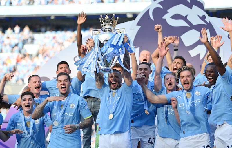 Manchester City skipper Kyle Walker lifts the Premier League trophy. Getty Images