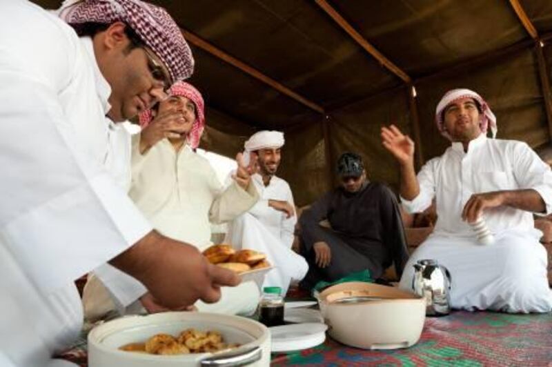 (back left) Ahmad Saleh Alshehhi,, Sultan Alshehhi. (front left) Mohammed Boshowairb, Mohammed Alshehhi and. True to reality and far removed from the tourist farms a group of emiratis attempt to represent their culture as the see it. Entertaining  tourists to both explain their traditional culture and how they live today. Duncan Chard for the National. Taken April 21, 2011
