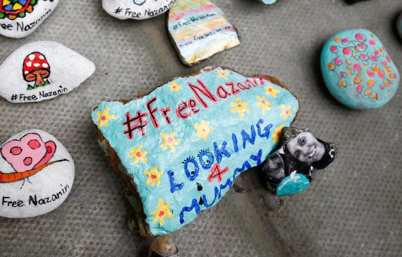 Stones with messages are placed on the pavement outside the Foreign and Commonwealth Office during a demonstration to demand the release of Nazanin Zaghari-Ratcliffe who is imprisoned in Iran, in London, Britain, March 10, 2018. REUTERS/Henry Nicholls