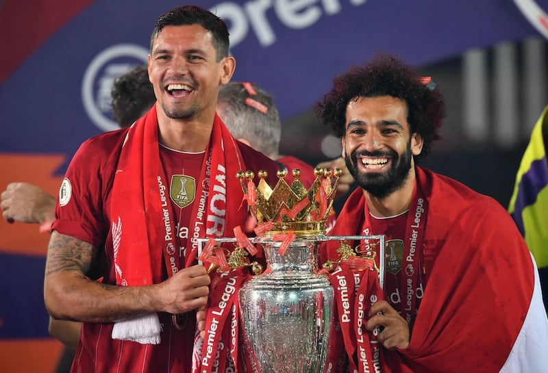 Liverpool's Dejan Lovren and Mohamed Salah lift the Premier League Trophy at Anfield. PA Photo. Picture date: Wednesday July 22, 2020. See PA story SOCCER Liverpool. Photo credit should read: Paul Ellis/NMC Pool/PA Wire. RESTRICTIONS: EDITORIAL USE ONLY No use with unauthorised audio, video, data, fixture lists, club/league logos or "live" services. Online in-match use limited to 120 images, no video emulation. No use in betting, games or single club/league/player publications.