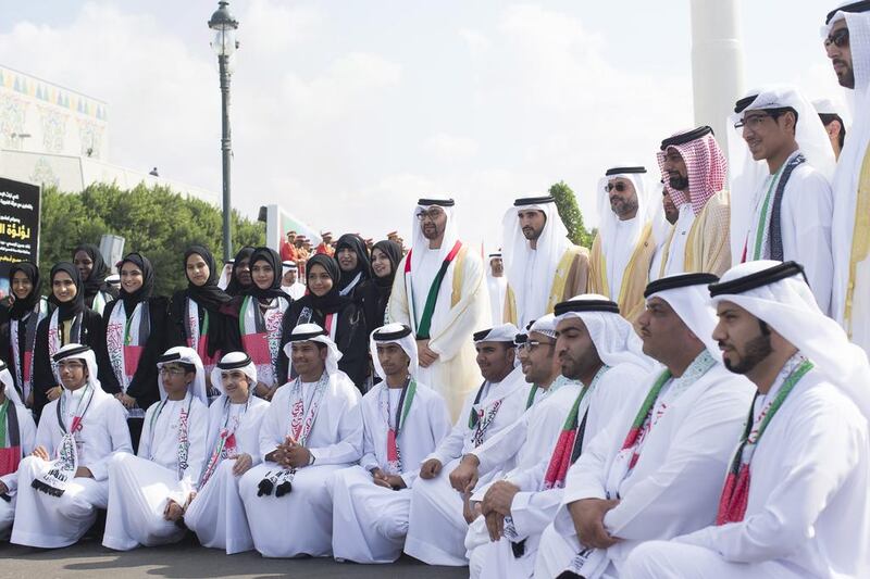 Sheikh Mohammed bin Zayed, Crown Prince of Abu Dhabi and Deputy Supreme Commander of the UAE Armed Forces, second row, seventh right, Sheikh Hamdan bin Mohammed, Crown Prince of Dubai sixth right, Sheikh Sultan bin Mohammed Al Qasimi Crown Prince of Sharjah, fifth right, Sheikh Mohammed bin Hamad Al Sharqi, Crown Prince of Fujairah, fourth right,and Sheikh Ammar bin Humaid Al Nuaimi, Crown Prince of Ajman, third right, stand for a photograph with the participants of Al Bayt Mitwahid at the Breakwater in Abu Dhabi. Ryan Carter / Crown Prince Court - Abu Dhabi
