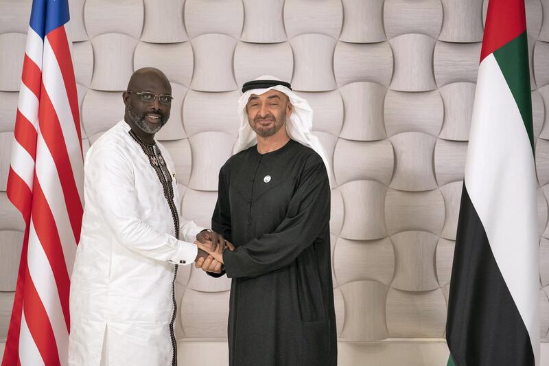 AL MARYAH ISLAND, ABU DHABI, UNITED ARAB EMIRATES - March 19, 2019: HH Sheikh Mohamed bin Zayed Al Nahyan, Crown Prince of Abu Dhabi and Deputy Supreme Commander of the UAE Armed Forces (R), stands for a photograph with HE George Weah, President of Liberia (L), after a dinner meeting at Zuma restaurant. 
( Ryan Carter / Ministry of Presidential Affairs )?
---