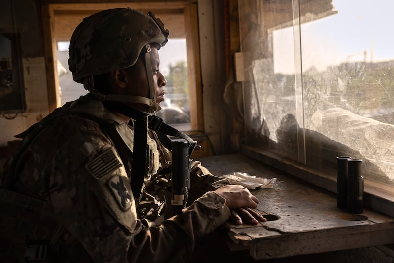 A US soldier looks onto Baghdad from a guardhouse near the International Zone, in May 2021. Getty Images