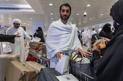 Yousef Abdullah Al Belooshi checks in for the Hajj pilgrimage at Dubai International Airport. Antonie Robertson / The National