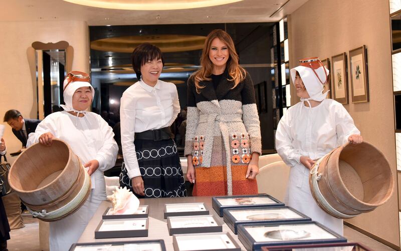 US first lady Melania Trump and her Japanese counterpart Akie Abe smile during their visit to Mikimoto Ginza Main Store, Japan's pearl jewellery maker, at Ginza shopping district in Tokyo. Katsumi Kasahara / Pool Photo via AP