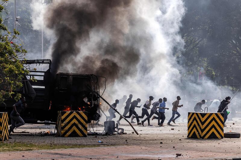 Running battles took place on Kenya's streets after police had opened fire on the crowds. AFP