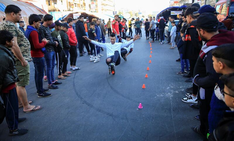 Iraqi demonstrators play during ongoing anti-government protests, in Baghdad, Iraq. Reuter