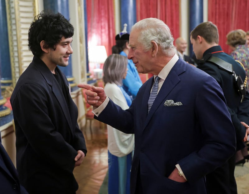 Actor Will Sharpe meets King Charles at the Buckingham Palace reception. Reuters