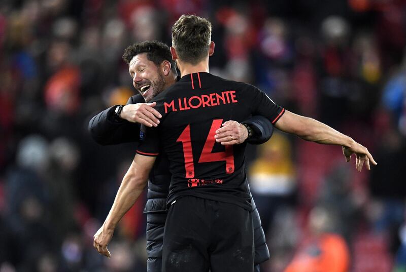 Diego Simeone, left, celebrates with Marcos Llorente after the win over Liverpool.  EPA