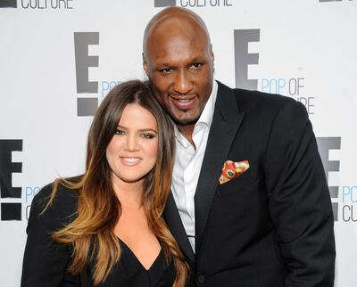 FILE - In this April 30, 2012, file photo, Khloe Kardashian Odom and Lamar Odom from the show "Keeping Up With The Kardashians" attend an E! Network upfront event at Gotham Hall in New York. A Los Angeles judge on Friday, Dec. 9, 2016, finalized Kardashian and Odom's divorce nearly three years after she first filed to end their marriage. The pair were married in September 2009. (AP Photo/Evan Agostini, File)