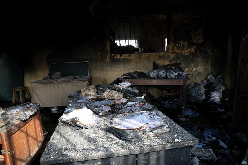 Burnt prison books are seen on the table after gunmen attacked and set the prison facility ablaze in Imo State, Nigeria. Reuters