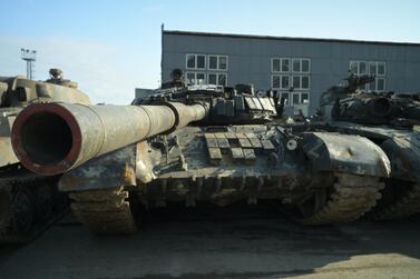 An Armenian tank waits to be repainted in a yard outside the Azerbaijani capital, Baku.