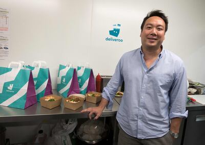 (FILES) In this file photo taken on July 03, 2018 co-founder and CEO of Deliveroo, William Shu, poses during the launch of first kitchen Deliveroo Editions in France,  in Saint-Ouen, outside Paris. Britain's app-driven food delivery firm Deliveroo is set for London's largest stock market launch in a decade with a valuation of £7.6 billion, despite mounting criticism over its treatment of riders on March 30, 2021. / AFP / GERARD JULIEN
