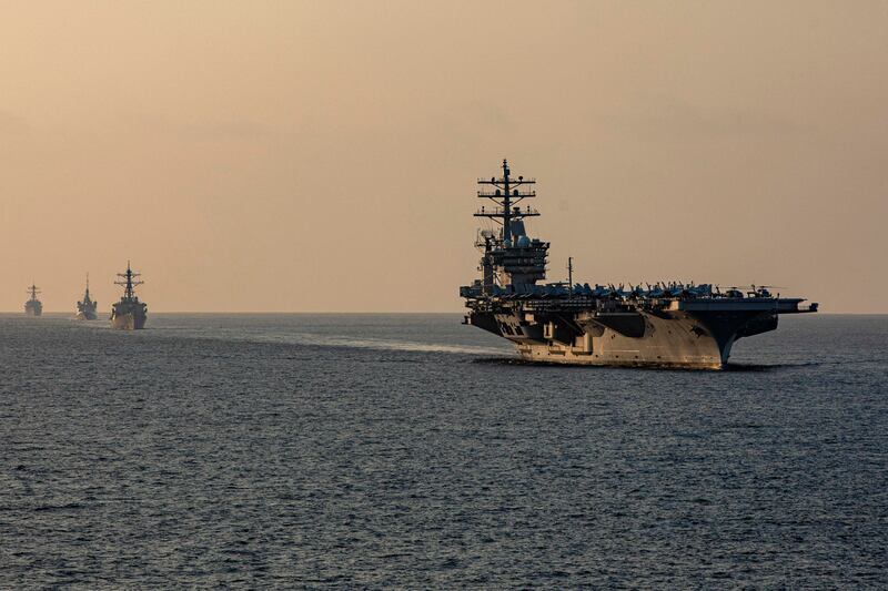 Components of the Eisenhower Carrier Strike Group transit the Strait of Hormuz. US Navy / Reuters