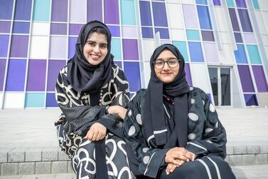 Urwa Tariq, left, a PhD student at UAE University, has just completed a study called Say Hello to the Hallyu Phenomena in the UAE. She is pictured with Ayesha Majid Al Jawadri, a fan of South Korean culture, at the UAEU campus in Al Ain. Photo: Antonie Robertson / The National