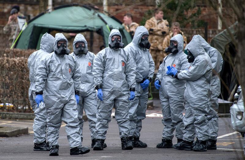 SALISBURY, ENGLAND - MARCH 11:  Military personnel wearing protective suits remove a police car and other vehicles from a public car park as they continue investigations into the poisoning of Sergei Skripal on March 11, 2018 in Salisbury, England. Sergei Skripal who was granted refuge in the UK following a 'spy swap' between the US and Russia in 2010 and his daughter remain critically ill after being attacked with a nerve agent.  (Photo by Chris J Ratcliffe/Getty Images)