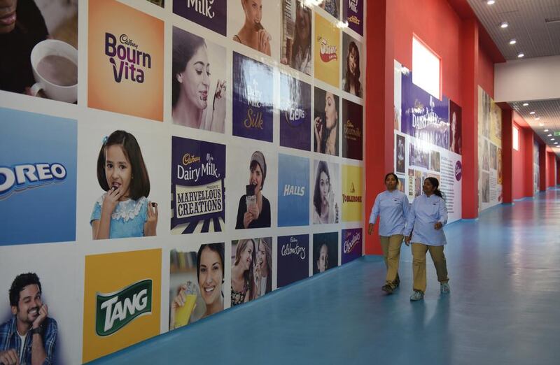 Indian workers walk through the Mondelez International facility in Andhra Pradesh. Arun Sankar / AFP