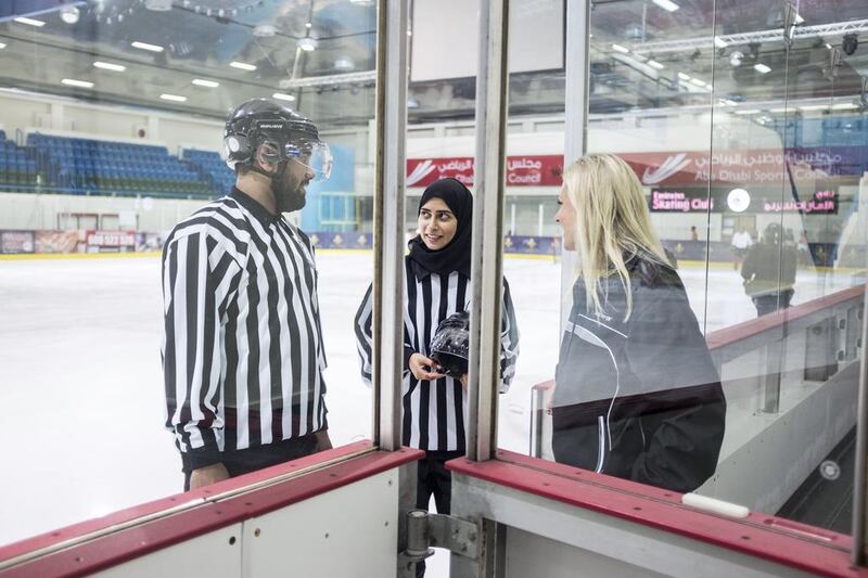 Joy Johnston, right, Emirates Hockey League (EHL) chief of games officials, with Fatima Al Ali, referee in the EHL and Yahya Al Jneibi, Deputy Chief of Games Official. Reem Mohammed / The National