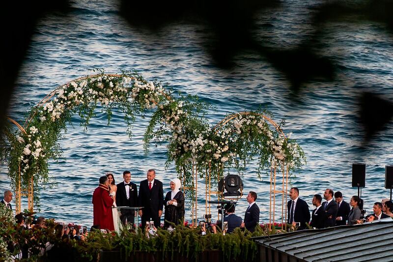 Arsenal's German midfielder Mesut Ozil and his fiance Amine Gulse stand next to Turkish President Recep Tayyip Erdogan and his wife Emine Erdogan during their wedding ceremony at the Four Seasons Bosphorus Hotel in Istanbul, Turkey.  AFP