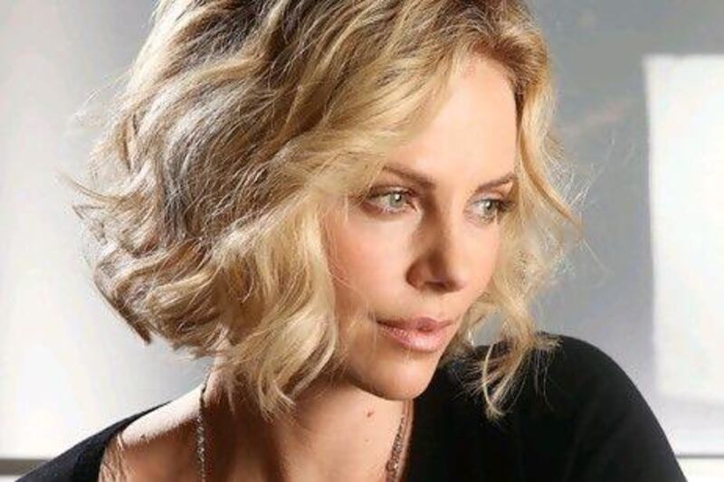 Actress Charlize Theron says she's reconciled to her new unattached life.