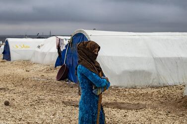 A displaced Syrian woman at the Washukanni Camp for internally displaced people near the predominantly Kurdish city of Hasakeh in northeastern Syria on February 17. Delil Souleiman/ AFP