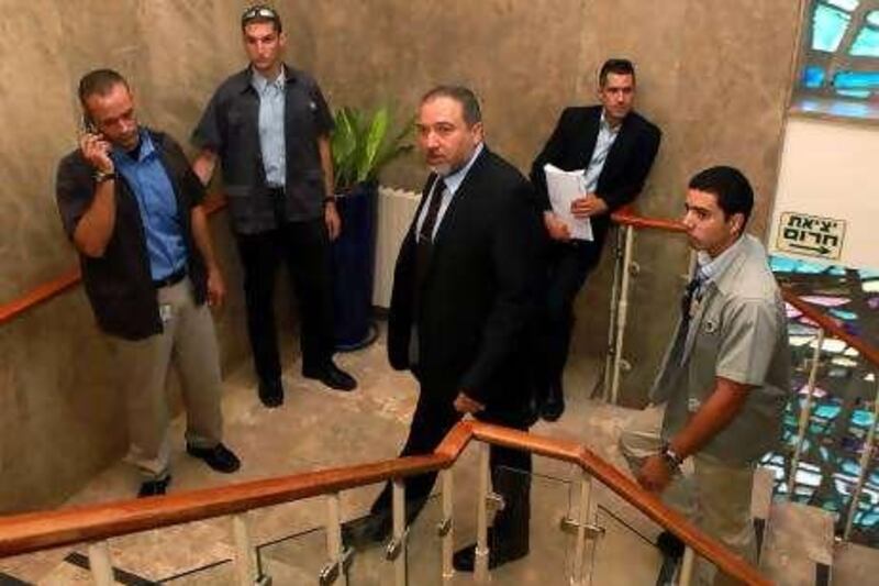 JERUSALEM, ISRAEL - SEPTEMBER 19:  Israeli foreign Minister Avigdor Lieberman (C) arrives in the offices of the prime minister in Jerusalem to attend the weekly cabinet meeting  on September 19, 2010 in Jerusalem, Israel. As Palestinian President Mahmoud Abbas travels to New York for meetings at the UN, Netanyahu refused to extend the West Bank settlement 'freeze' even though this remains an essential part of the ongoing peace process with the Palestinians. (Photo by Jim Hollander - Pool/Getty Images) *** Local Caption ***  GYI0061724705.jpg