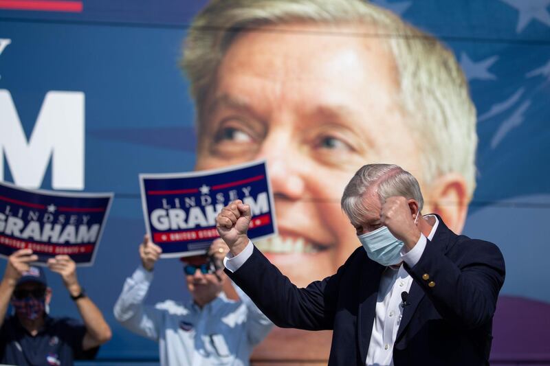 (FILES) In this file photo taken on October 16, 2020 US Senator Lindsey Graham arrives to address supporters for a get out the vote rally at the Charleston Coliseum and Convention Center in North Charleston, South Carolina.  US Senator Lindsey Graham of South Carolina won reelection on November 3, 2020, US media reported. / AFP / Logan Cyrus
