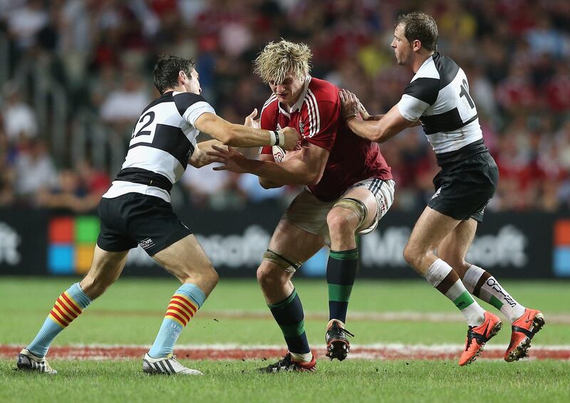 HONG KONG - JUNE 01:  Richie Gray of the Lions is tackled by James Hook and Nick evans (R) during the match between the British & Irish Lions and the Barbarians at Hong Kong Stadium on June 1, 2013,  Hong Kong.  (Photo by David Rogers/Getty Images) *** Local Caption ***  169765683.jpg