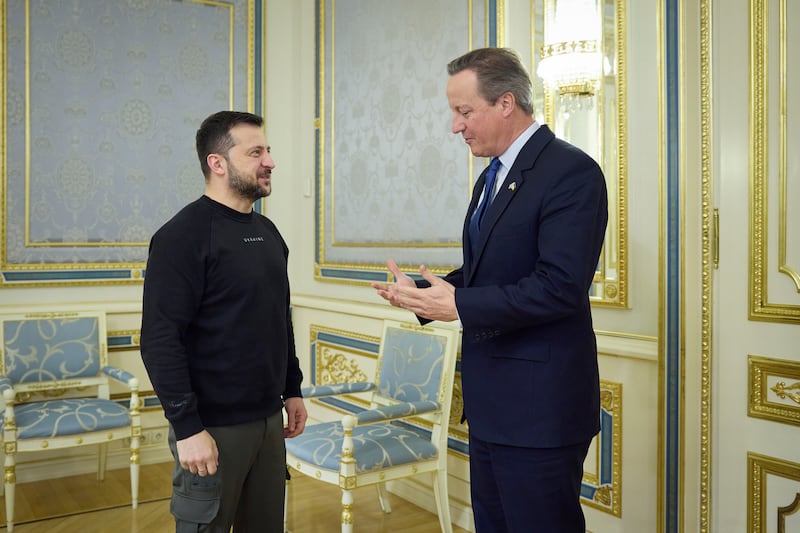 Ukrainian President Volodymyr Zelenskyy speaks to Britain's Foreign Secretary David Cameron in Kyiv. AP