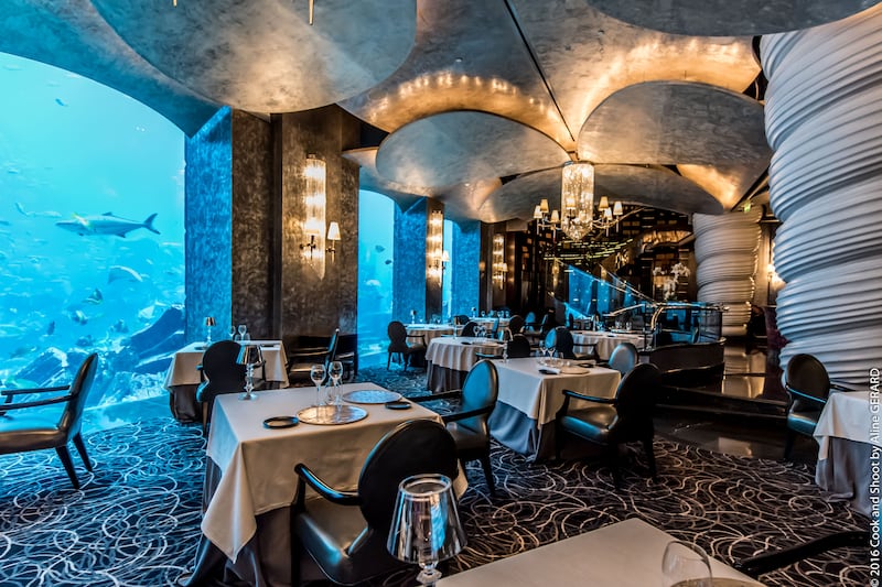 Experiential dining at Michelin-starred Dubai restaurant Ossiano, which looks into an aquarium. Photo: Ossiano