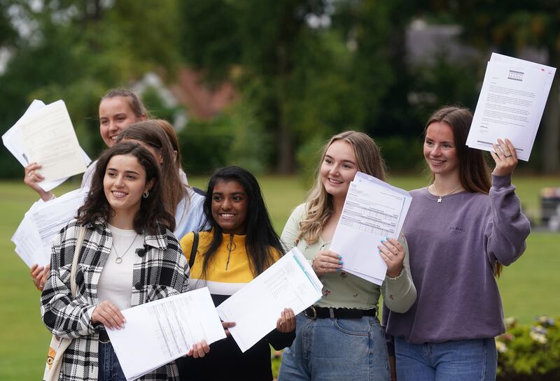 Pupils at Strathearn Grammar School in Belfast celebrate after receiving their A-level results. PA