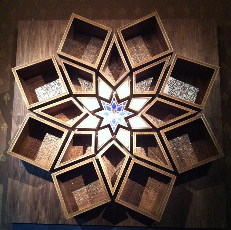 A wall-mounted bookcase inspired by the Islamic sunburst design, Shamsa. Courtesy Naseer Yasna