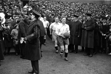 The England national football team captain, George Wilson, leads his side out to face Scotland in Glasgow in April 1923. England will compete in its 1,000th international against Montenegro on November 14, 2019.  Photo by Topical Press Agency / Getty Images