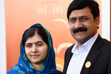 NEW YORK, NY - SEPTEMBER 24: Documentary subject and activist, Malala Yousafzai (L) and father, Pakistani diplomat Ziauddin Yousafzai attend the "He Named Me Malala" New York premiere at Ziegfeld Theater on September 24, 2015 in New York City. (Photo by Dimitrios Kambouris/Getty Images)