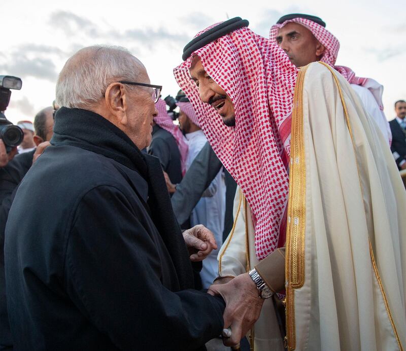 King Salman is welcomed by President Essebsi upon his arrival. EPA