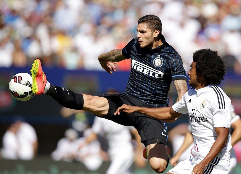 Mauro Icardi scored Inter Milan's penalty equaliers and later converted the winning spot kick in the shootout after Inter and Real Madrid drew 1-1 at the International Champions Cup on Saturday in Berkeley, California. Ezra Shaw / Getty Images / AFP / July 26, 2014