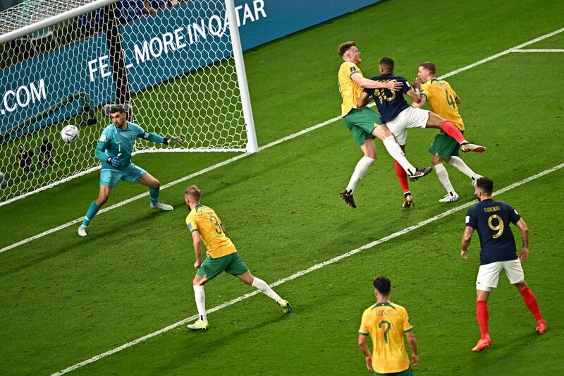 France's forward #10 Kylian Mbappe scores his team's third goal (2nd R top) during the Qatar 2022 World Cup Group D football match between France and Australia. AFP