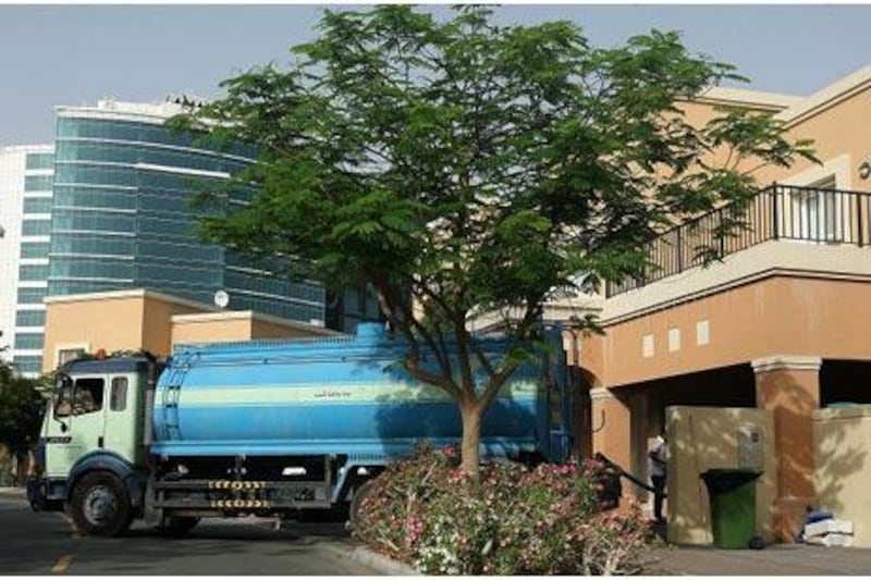 A private tanker delivers water to a villa at Dubai Silicon Oasis. Pawan Singh / The National
