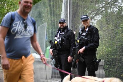 British police officers patrol outside the security fence erected around the perimeter of Treganna Castle near St Ives, Cornwall on June 10, 2021, ahead of the three-day G7 summit being held from 11-13 June.  G7 leaders from Canada, France, Germany, Italy, Japan, the UK and the United States meet this weekend for the first time in nearly two years, for the three-day talks in Carbis Bay, Cornwall. - 
 / AFP / DANIEL LEAL-OLIVAS
