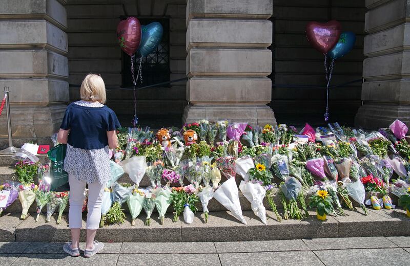 Flowers on the steps of Nottingham Council House after three people were killed and another three hurt in connected attacks on Tuesday morning. PA