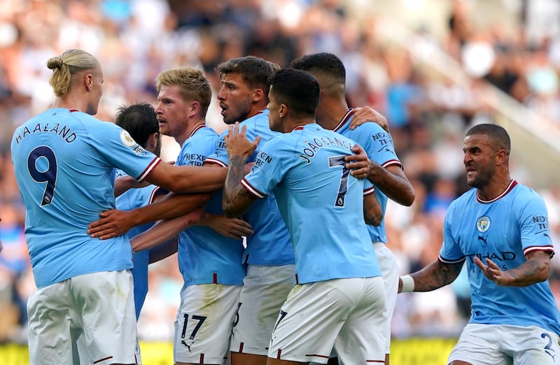 Manchester City players celebrate after Bernardo Silva scores their third goal in the 3-3 draw against Newcastle at St James' Park on August 21, 2022. PA